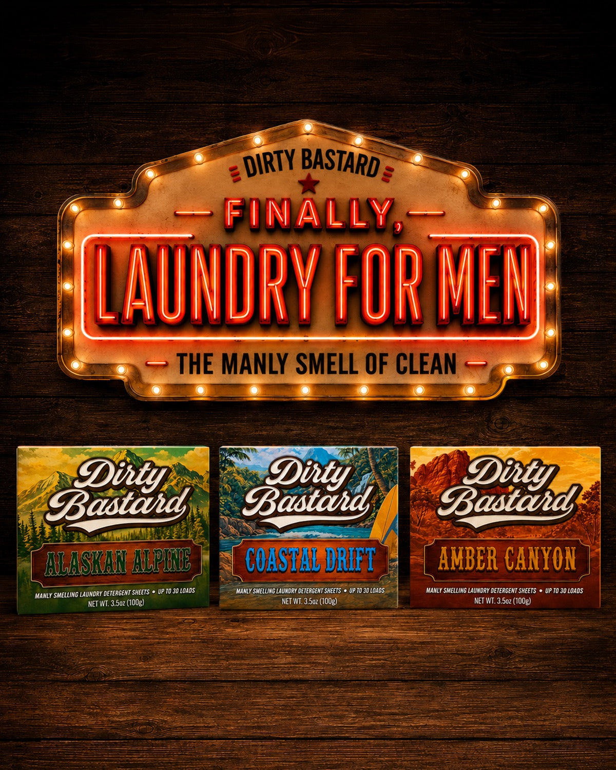 A lit marquee sign reading Finally, Laundry For Men. The manly smell of clean. Below it the three Dirty Bastard scents: Alaskan Alpine, Coastal Drift, and Amber Canyon.